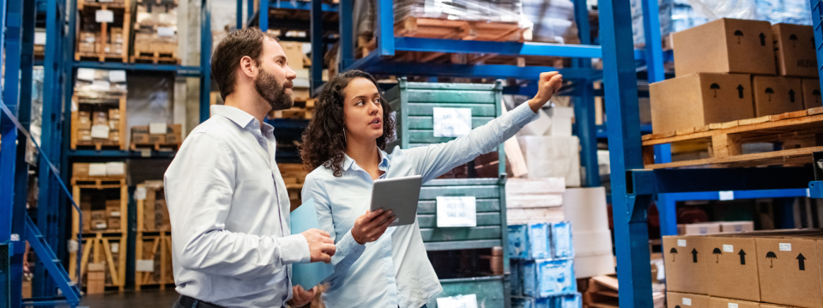 Supervisor pointing out to the worker about a potential safety hazard in a warehouse