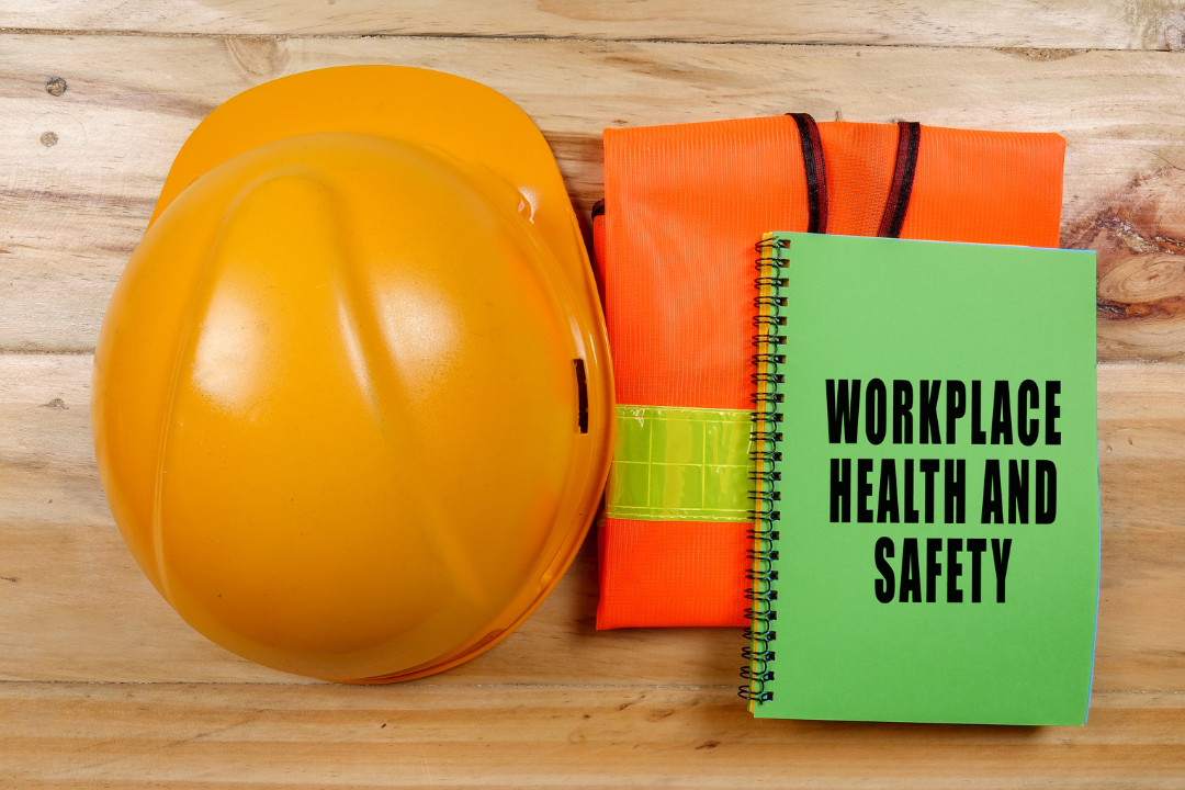 Workplace Health and Safety Policy Manual with a safety vest and hard hat - Naloxone in the Workplace